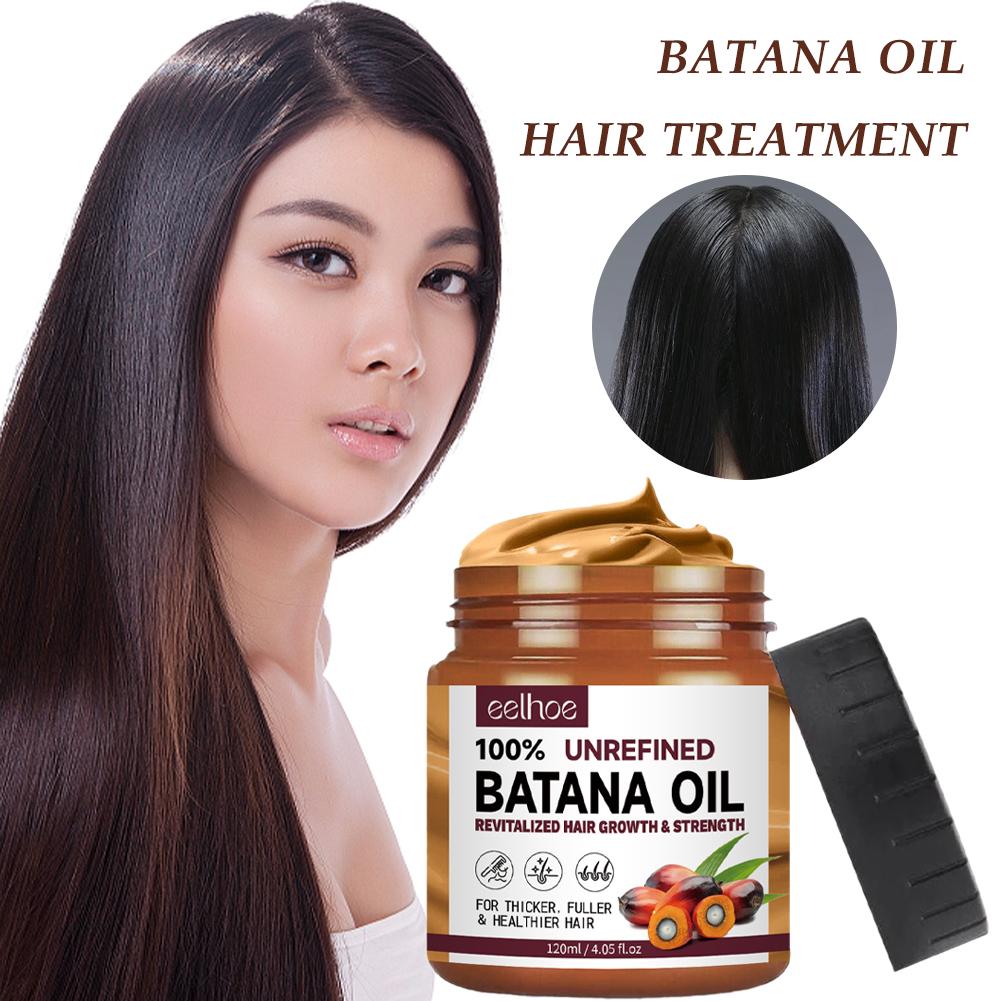 Clear bottle of 100% pure Batana oil for hair and skin care, shown against a plain background, highlighting its rich texture.
