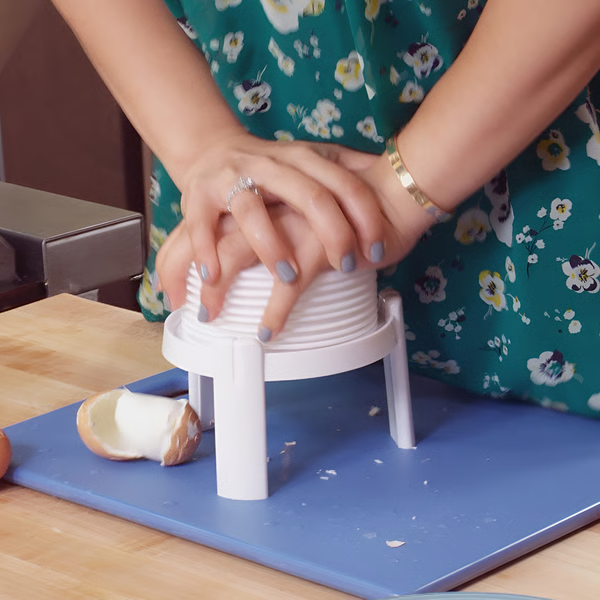 "Creative egg peeler tool for quick, safe shell removal; efficient kitchen gadget with sleek design and compact portability."