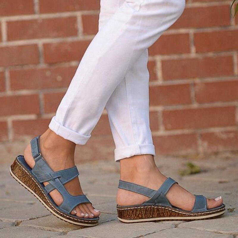 "Elegant women's strappy wedge sandals with open toes, slingback straps, and a cork-look base, perfect for summer style."