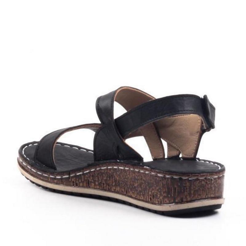 "Elegant women's strappy wedge sandals with open toes, slingback straps, and a cork-look base, perfect for summer style."
