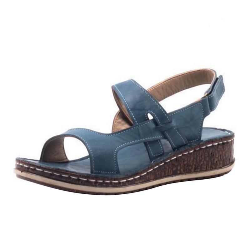 "Elegant women's strappy wedge sandals with open toes, slingback straps, and a cork-look base, perfect for summer style."