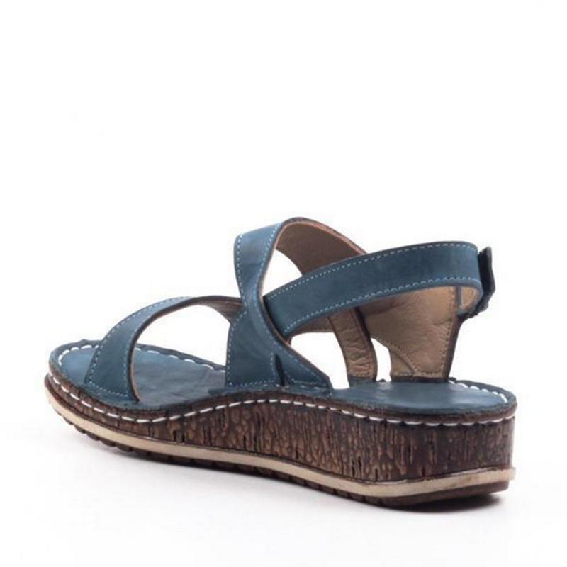 "Elegant women's strappy wedge sandals with open toes, slingback straps, and a cork-look base, perfect for summer style."