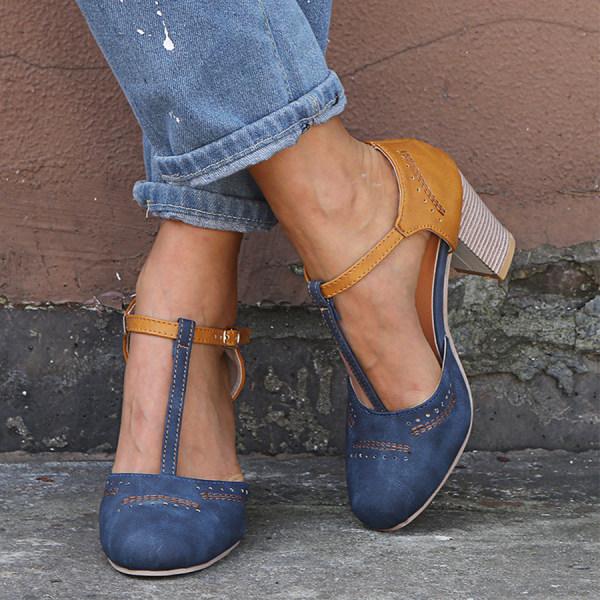"T-Strap block heels with vintage charm, closed round toe, adjustable ankle buckle, faux suede finish."