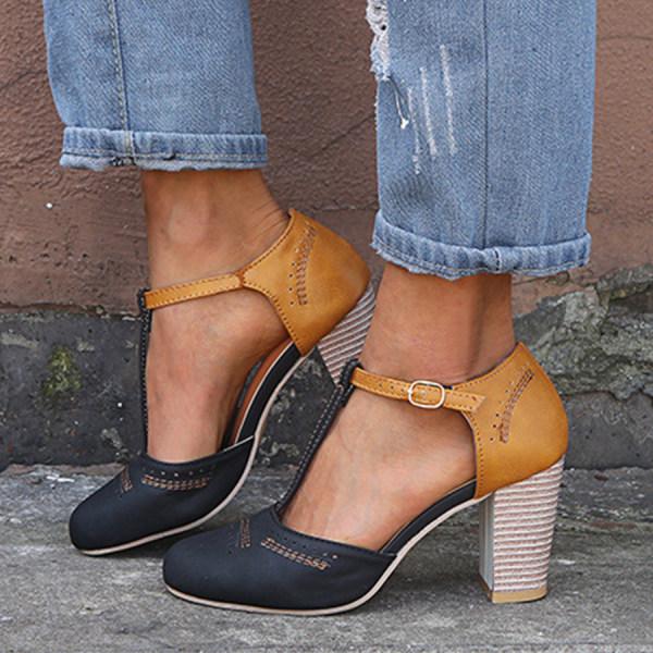 "T-Strap block heels with vintage charm, closed round toe, adjustable ankle buckle, faux suede finish."