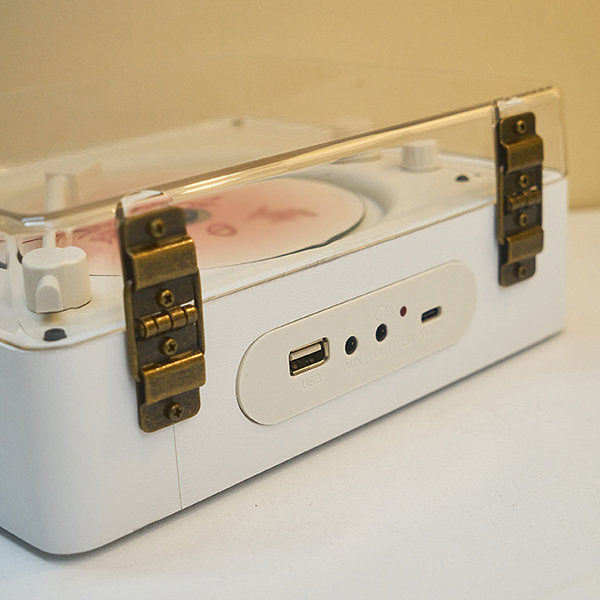 "Vintage-inspired CD player with chrome accents, analog knobs, and LCD display, blending nostalgic design with modern tech."