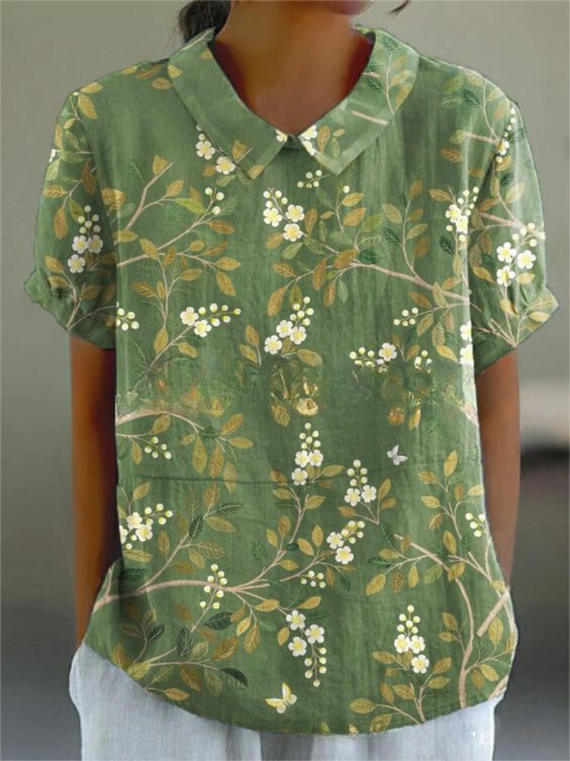 Women's blouse with short gathered sleeves, pointed collar, relaxed fit, perfect for spring-summer style and comfort.