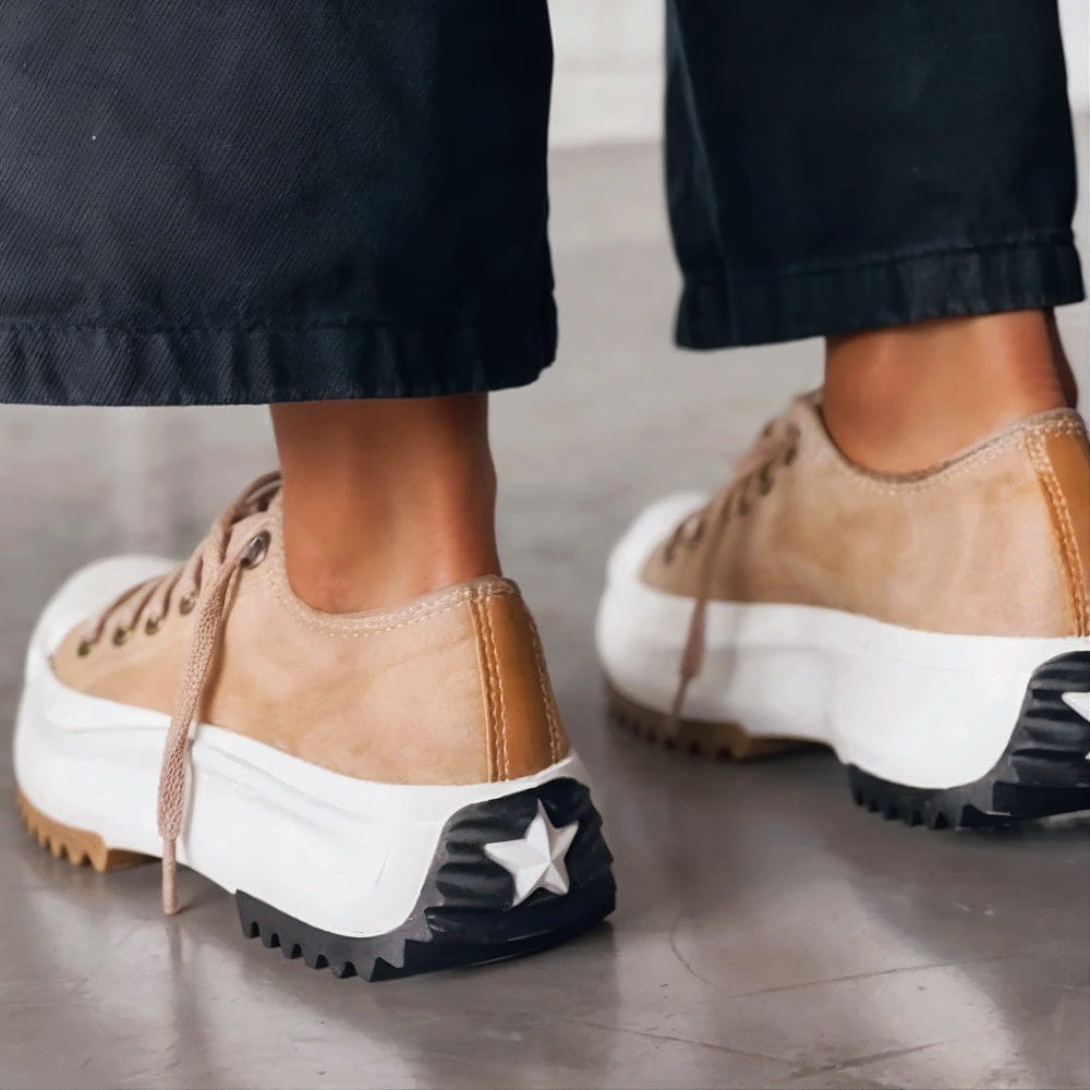 Women's chunky platform sneakers with a bold sole, rounded toe, and trendy contrast details for stylish all-day comfort.