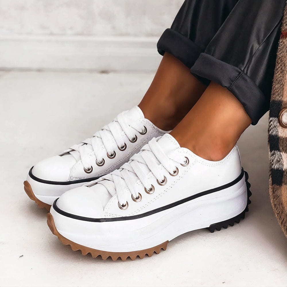 Women's chunky platform sneakers with a bold sole, rounded toe, and trendy contrast details for stylish all-day comfort.