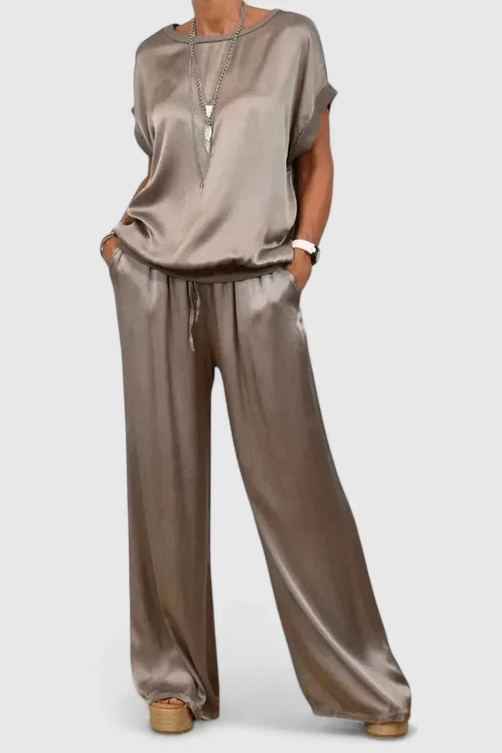 Trendy women's comfort wear: elegant batwing sleeve top & wide leg trouser matching set, perfect for loungewear or smart casual.