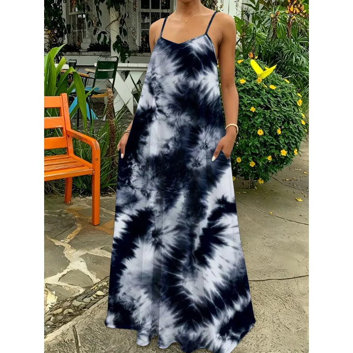 Bohemian women's flowing strappy maxi dress with vibrant tie-dye pattern. Stylish summer casual.
