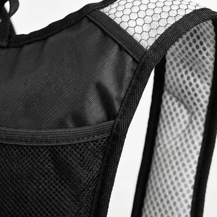 Lightweight, durable 10L hydration backpack. Ideal for outdoor trail cycling. Water repellent, compact, black.