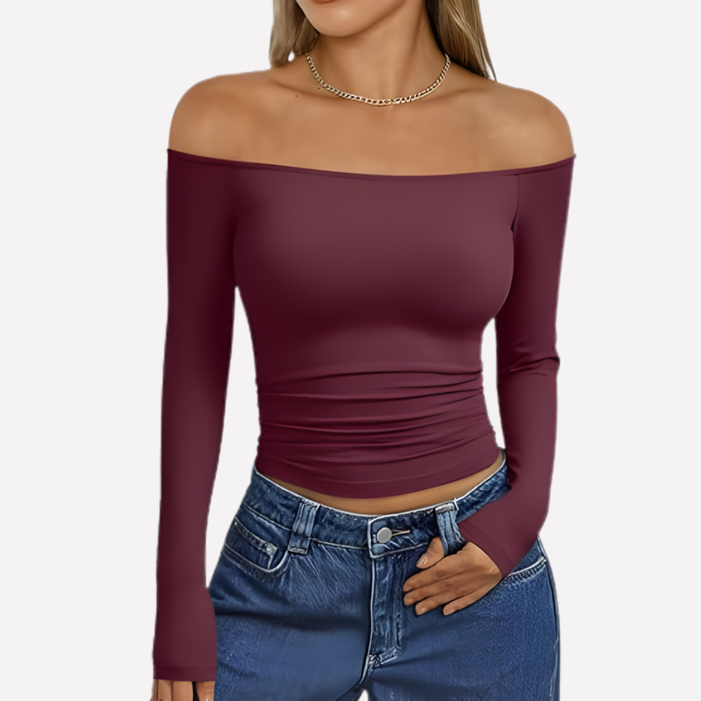 Attractive off-shoulder long sleeve women's top, providing a chic and relaxed fit for various occasions.