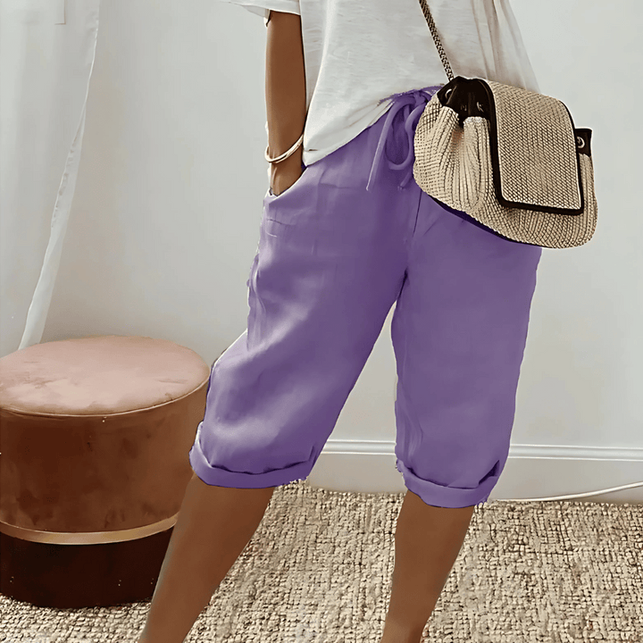Stylish women's knee-length harem shorts, offering a relaxed fit with elastic waist for casual summer and vacation comfort.