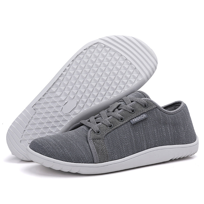 Person wearing lightweight unisex zero-drop walking shoes, ideal for daily wear, comfort, and natural alignment.