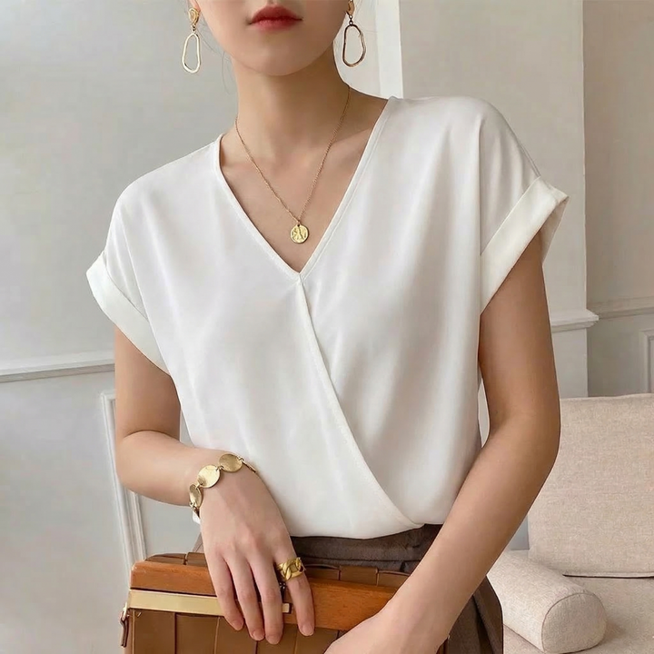 White V-Neck Twist Front Top for women. A comfortable & stylish short sleeve option for versatile everyday wear.