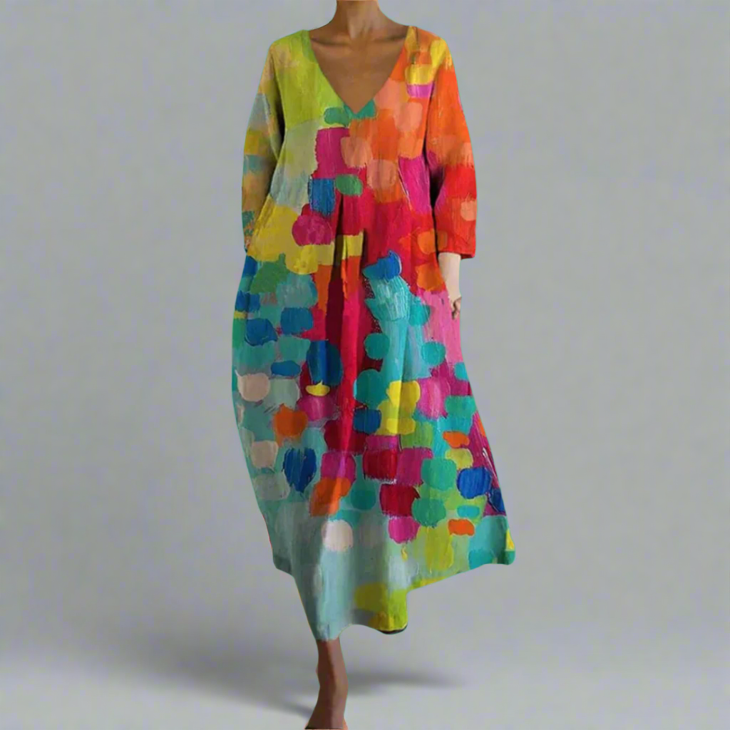 Women's artistic bohemian colorful maxi dress with a flowy abstract design, perfect for summer vacation or festivals.