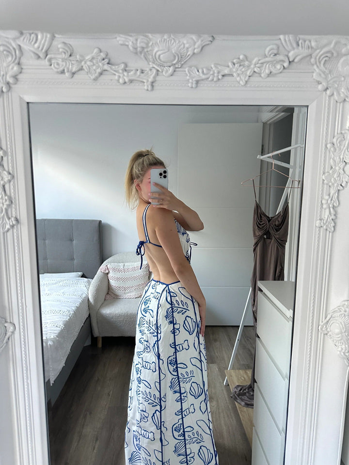 Versatile women's summer maxi sundress for casual wear or elegant vacations. Features an open-back and flowy fit.