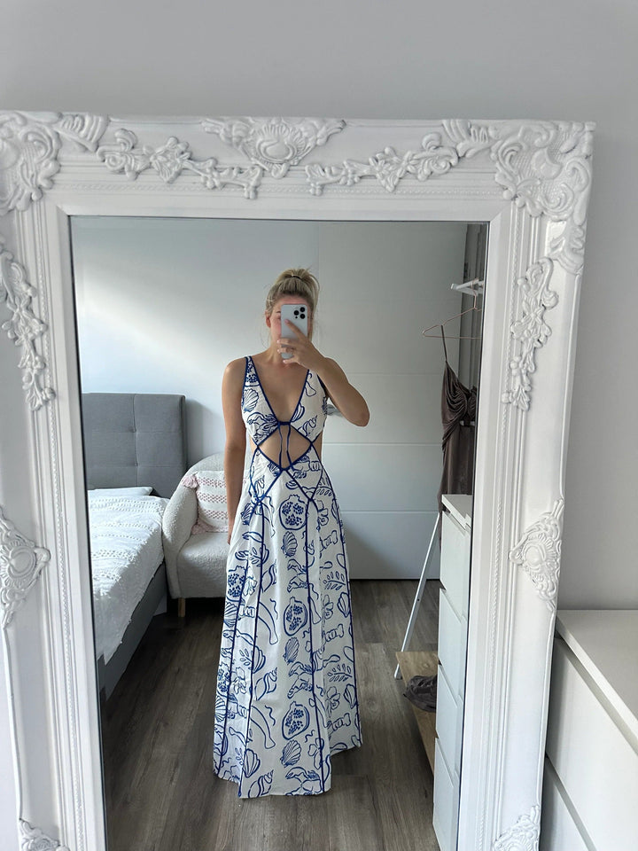 Blue women's vacation maxi sundress, flowy and effortless, ideal for summer beachwear & casual elegant looks.