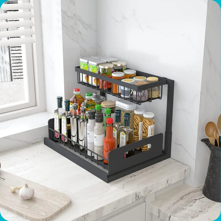 "2 tier slide out under sink organizer with L-shaped design, fits pipes, maximizes space, holds kitchen and bath essentials."
