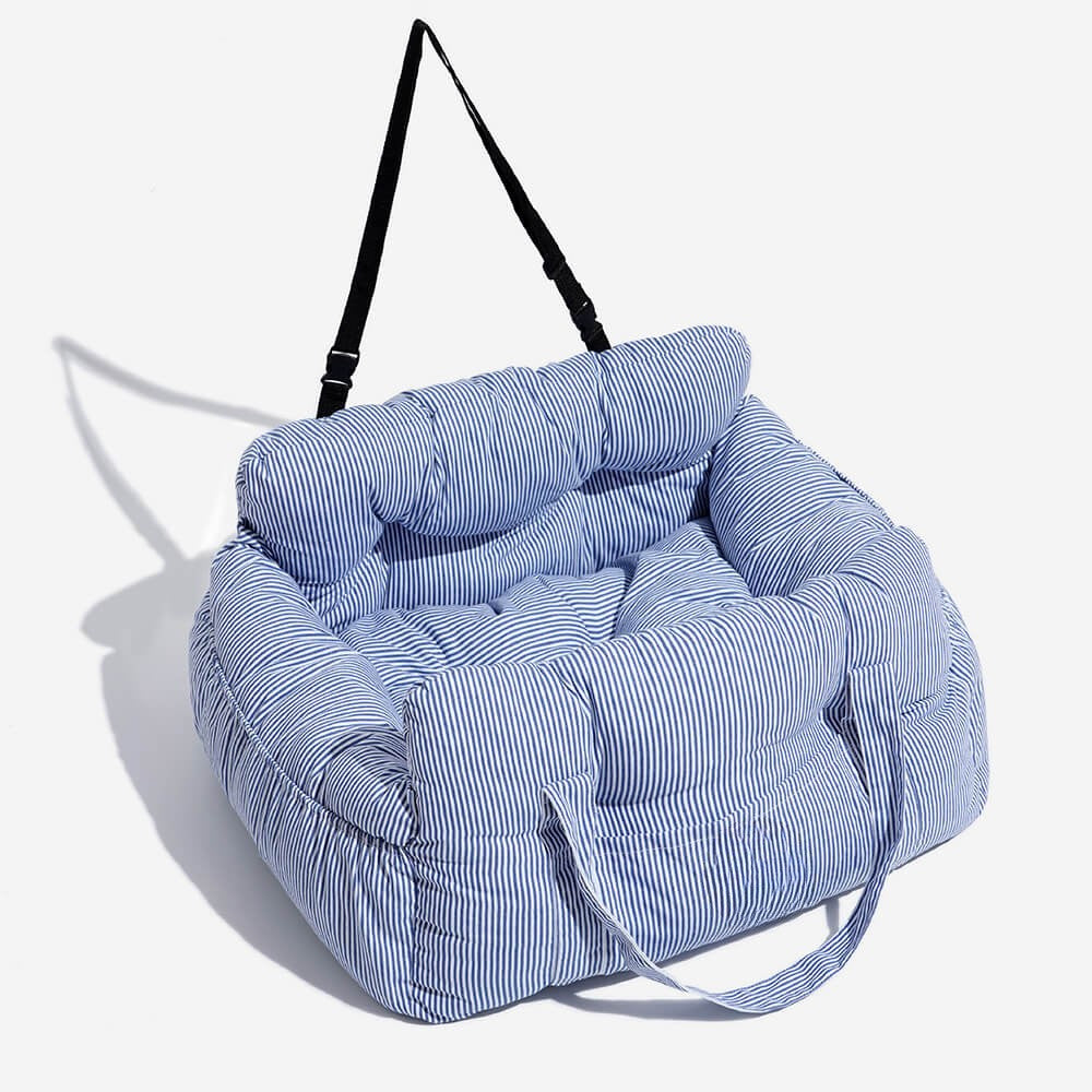 Portable dog booster seat for car, convertible into a pet bed & carrier. Ideal for secure dog travel.