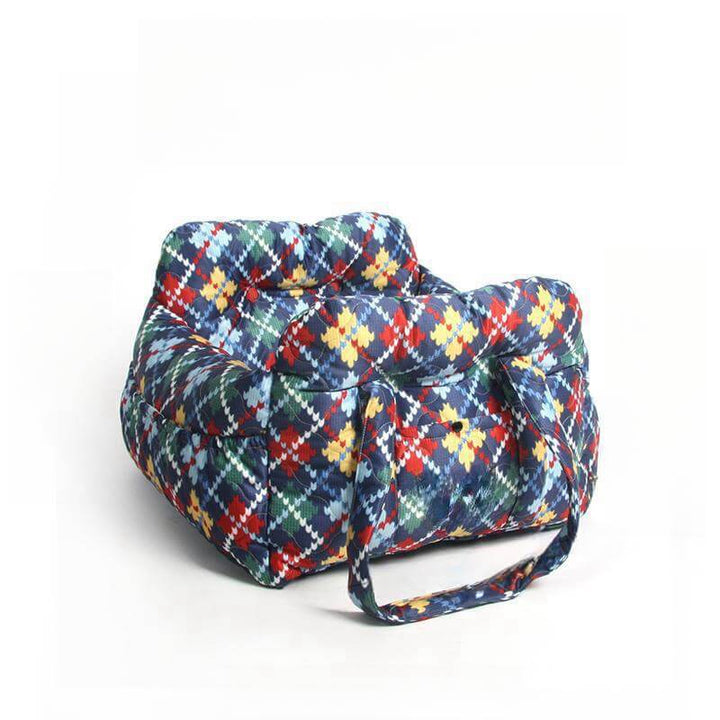Washable dog travel car seat, pet carrier, and portable bed. Durable dog gear for all vehicle types.