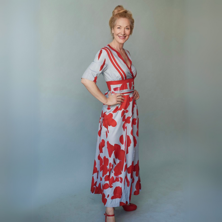 Vibrant floral print on a comfortable women's wrap dress, showcasing chic, timeless spring/summer fashion.