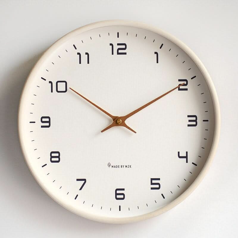 Silent quartz Scandinavian wooden wall clock, minimalist beige design. Modern home decor for living room or office.