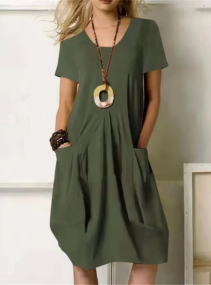 Women's casual short-sleeve swing dress with a relaxed fit, perfect for comfortable everyday wear or summer days.