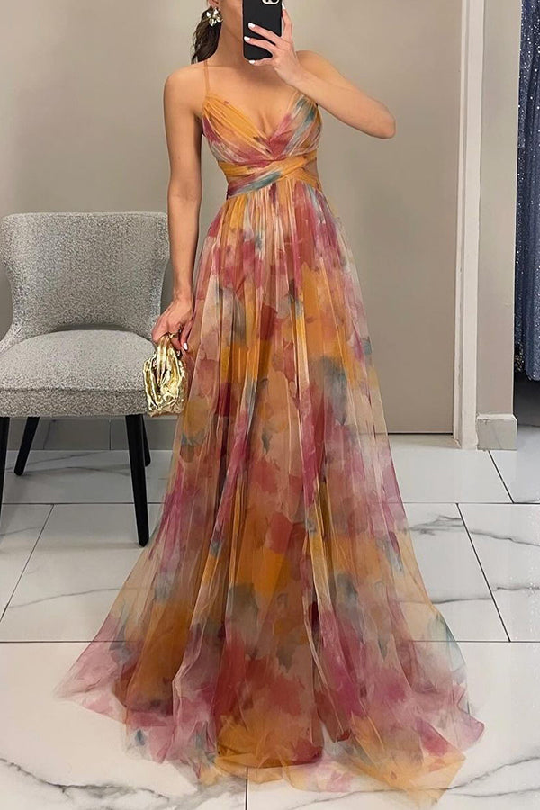 Elegant women's flowy maxi dress with vibrant floral print, suitable for evening wear.