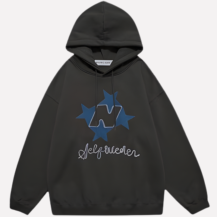 Modern oversized women's hoodie showcasing a large star graphic. Streetwear-ready, comfy pullover.