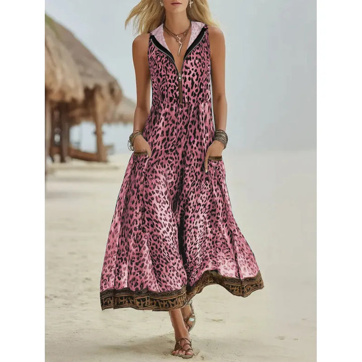 Chic women's animal print maxi dress featuring a hood, sleeveless design, and practical side pockets.