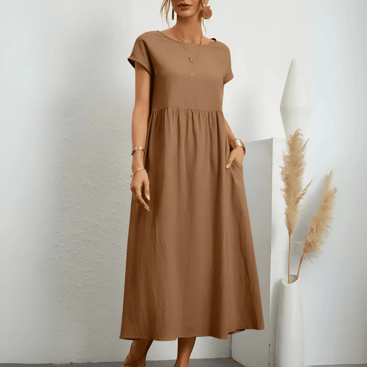 Women's vintage style flowy maxi dress with O-neck & short sleeves, perfect for summer comfort & elegance.