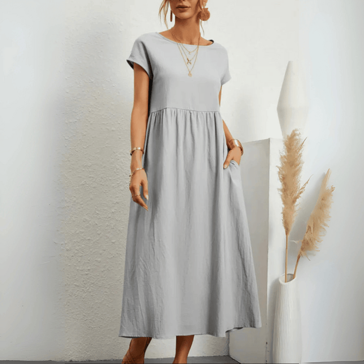 Elegant women's flowy maxi dress, ideal for summer vacations & casual wear, featuring vintage style & comfort.