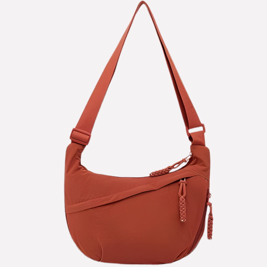 Back view of women's crescent crossbody bag, featuring a secure zippered pocket for essentials.