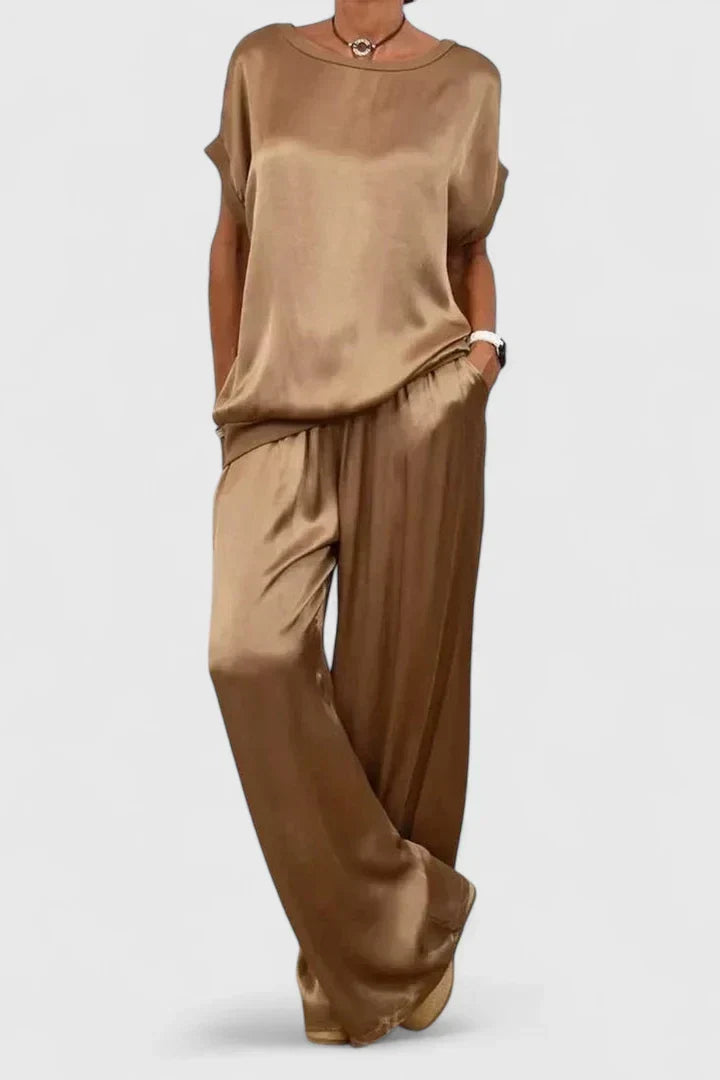 Stylish women's two-piece set featuring a loose batwing top and flowing wide-leg trousers, ideal for elegant smart casual occasions.
