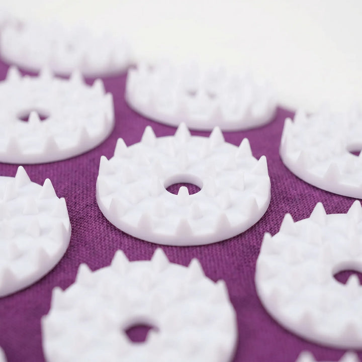 Acupressure pillow for neck pain relief, promoting relaxation and reducing stress with therapeutic spikes.