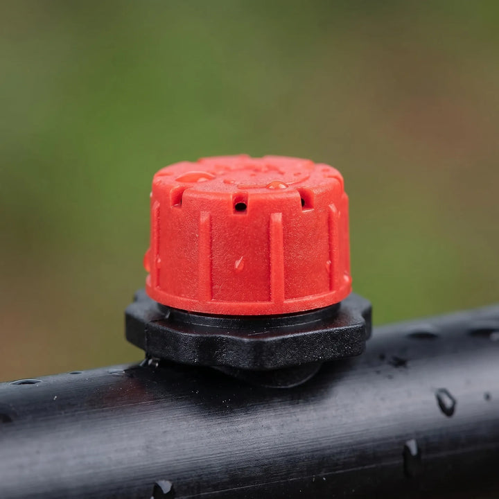 Adjustable micro drip irrigation system drippers for targeted watering in gardens & greenhouses.