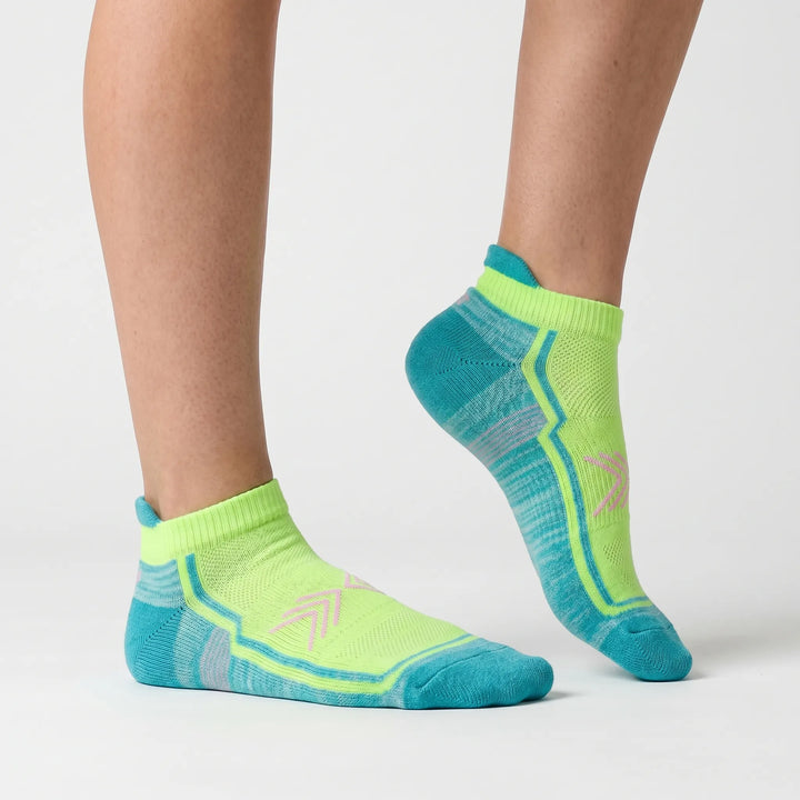 Green women's performance ankle socks. Breathable quick-dry activewear for sports.
