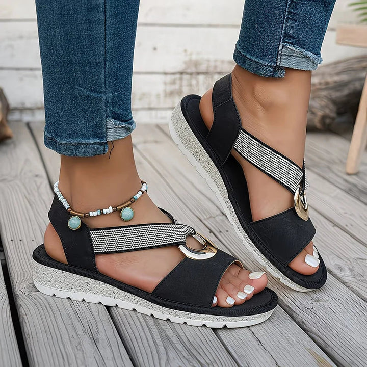 Supportive women's stretch strap sandals with arch support, orthopedic features & a sleek metallic design.