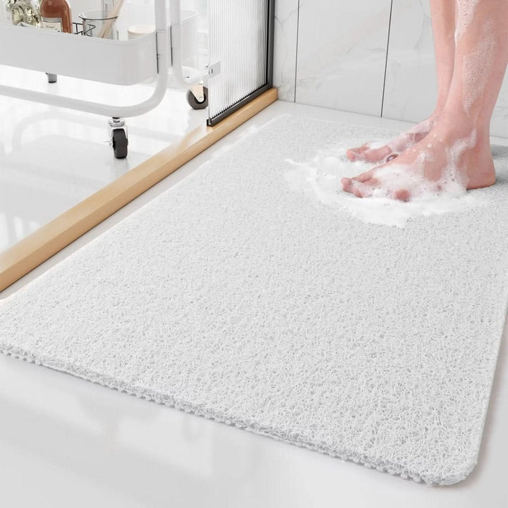 Hygienic shower mat with efficient drainage system, providing non-slip bathroom safety & spa comfort.