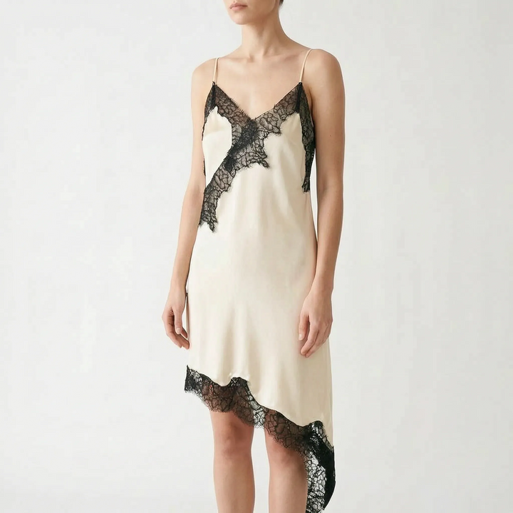 Stunning women's asymmetric lace slip dress with intricate detailing, creating an elegant party look.