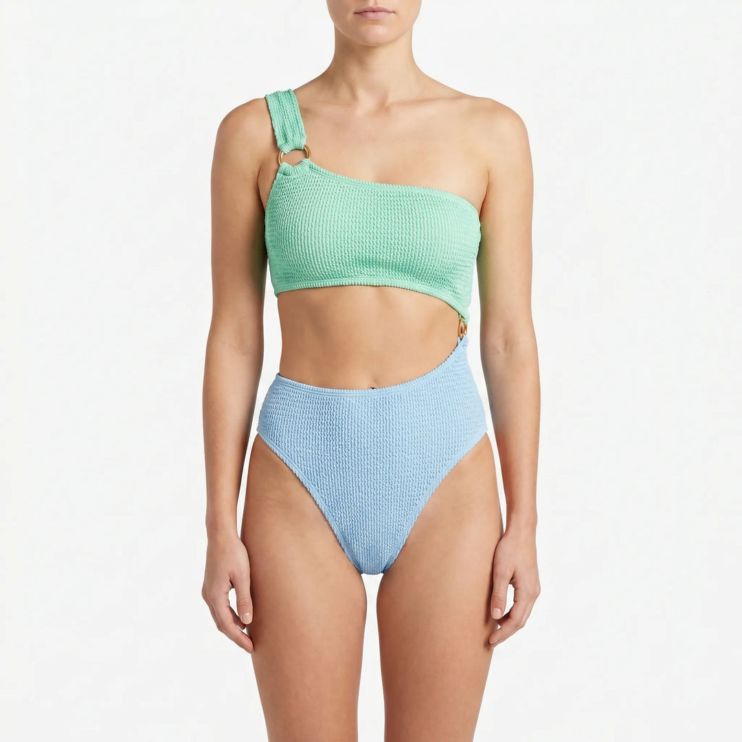 Women's sleek asymmetric monokini swimsuit with daring cut-outs, perfect for modern beach fashion.