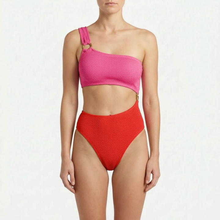 Women's vacation essential: an asymmetric monokini one-piece swimsuit with chic cut-outs & modern style.
