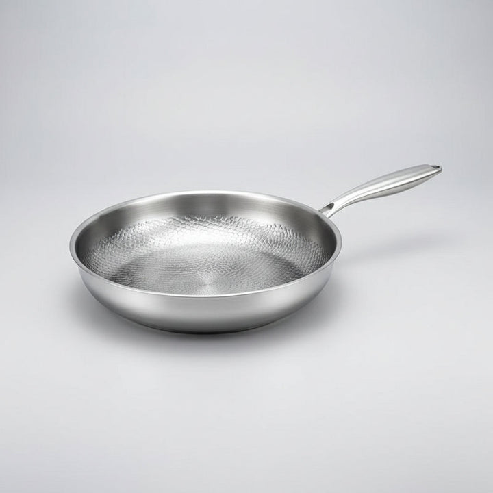 Premium hammered titanium non-stick frying pan. Induction compatible skillet for durable, healthy kitchen use.