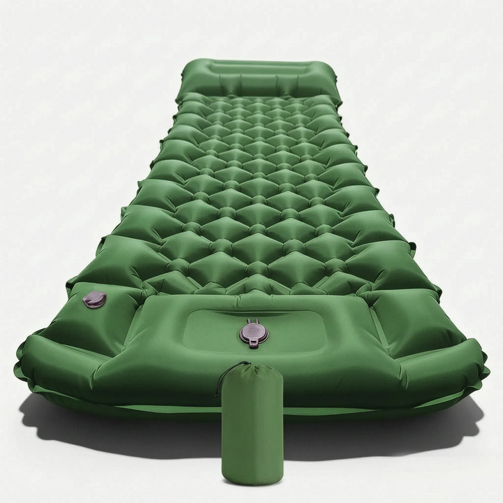 Unrolled inflatable camping sleeping mat with an integrated pillow, ready for a comfortable night's sleep outdoors.