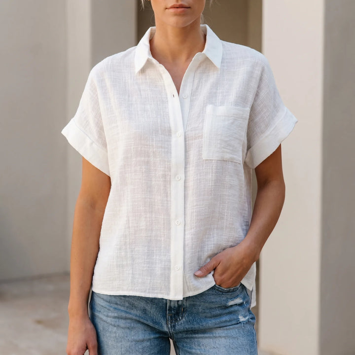 Women's loose fit short sleeve button-down shirt, perfect for casual comfort and everyday wear.