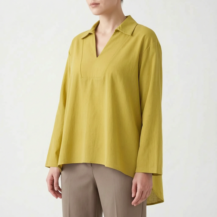 Fashionable women's long sleeve high-low tunic. Solid color v-neck blouse, versatile for casual or dressy looks.