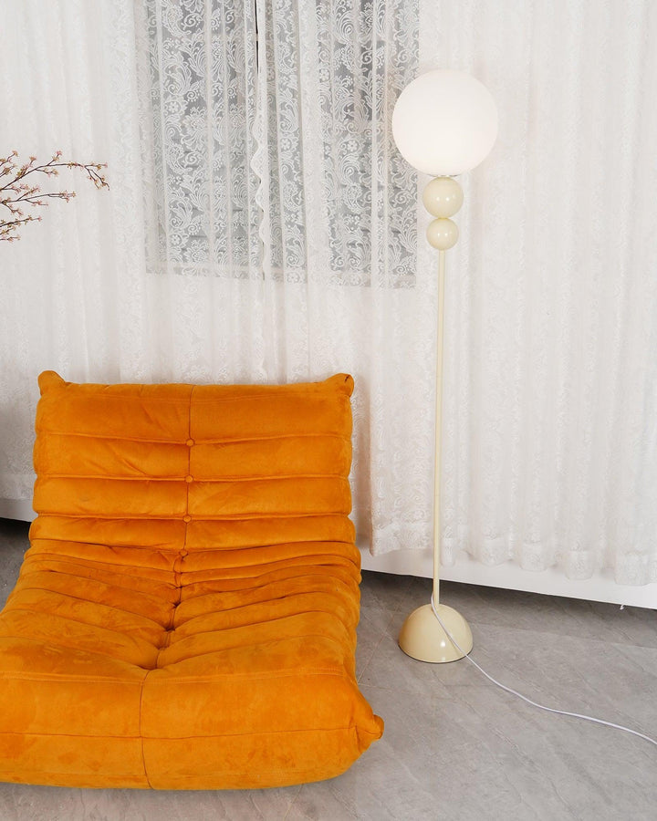 Sleek milky white modern metal & glass floor lamp, an aesthetic addition to home decor.