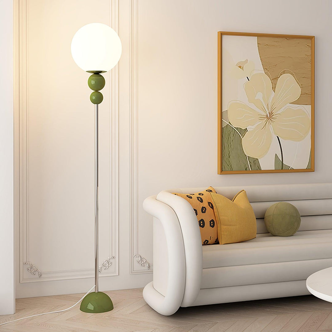 Modern metal & glass floor lamp, sleek design for elegant living room decor.