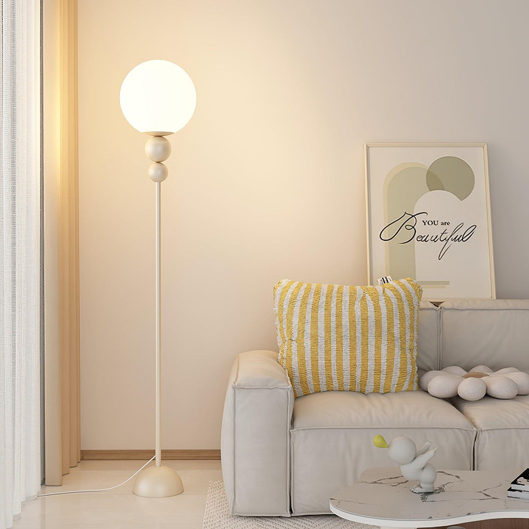 Elegant indoor metal & glass floor lamp, ideal for modern bedroom ambiance.